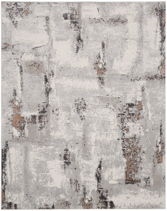 Rectangular abstract distressed rug in light gray, beige and brown tones with charcoal accents.