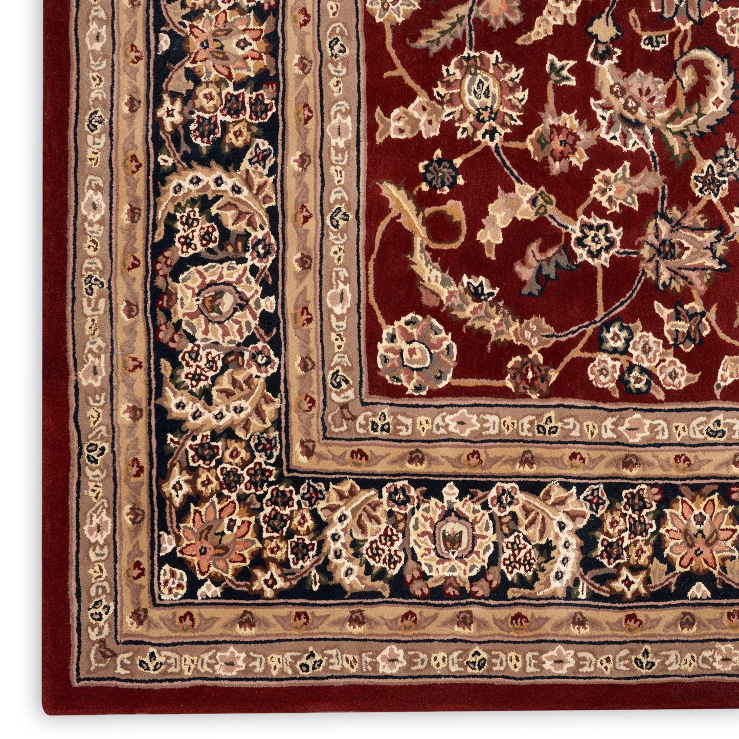 Persian-style rectangular area rug close-up: red field with ornate beige borders and intricate floral motifs.