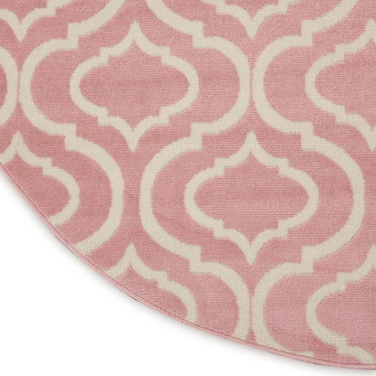 Pink rug featuring white lattice trellis pattern with a curved edge.