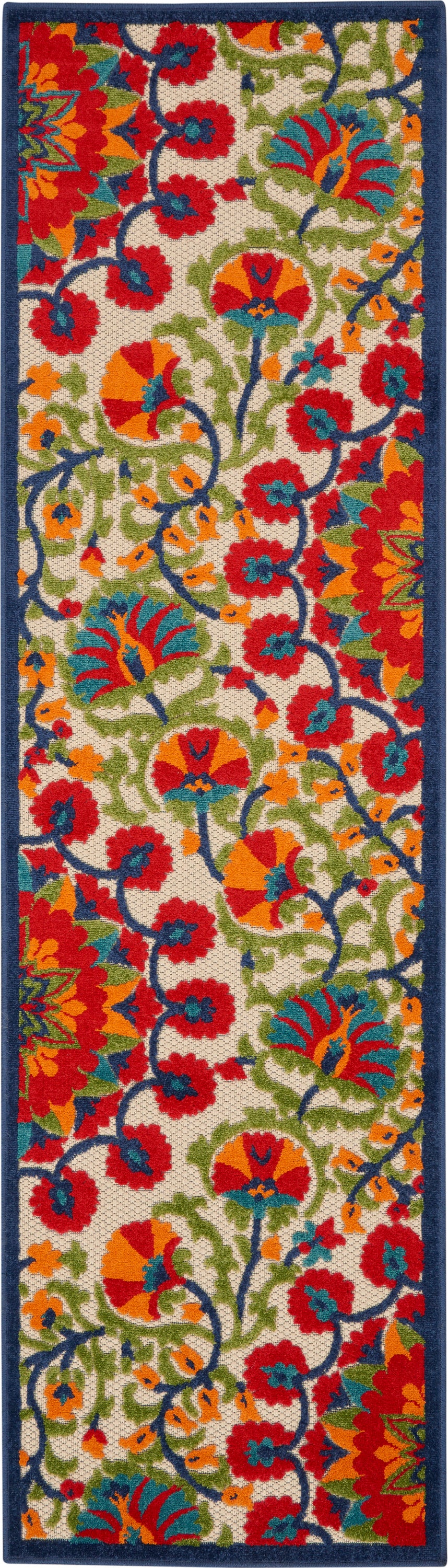Woven rectangular floral runner rug with cream background, bold red, orange and blue flowers, green vines, navy border.