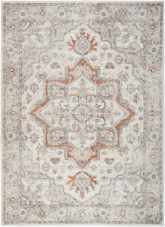 Rectangular distressed Persian-style area rug with ivory backdrop, blue and rust medallion motifs and ornate border.