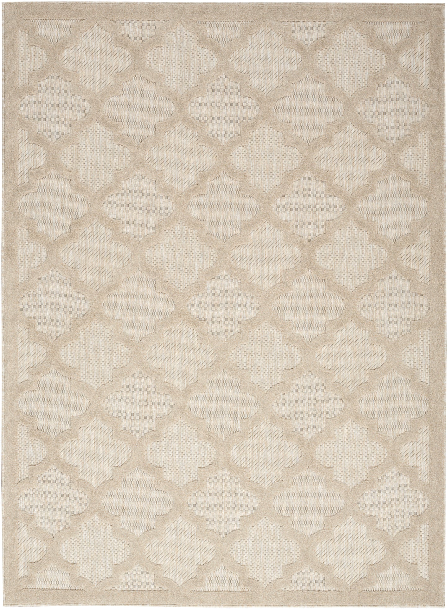 Beige woven area rug featuring a cream and tan quatrefoil lattice pattern.