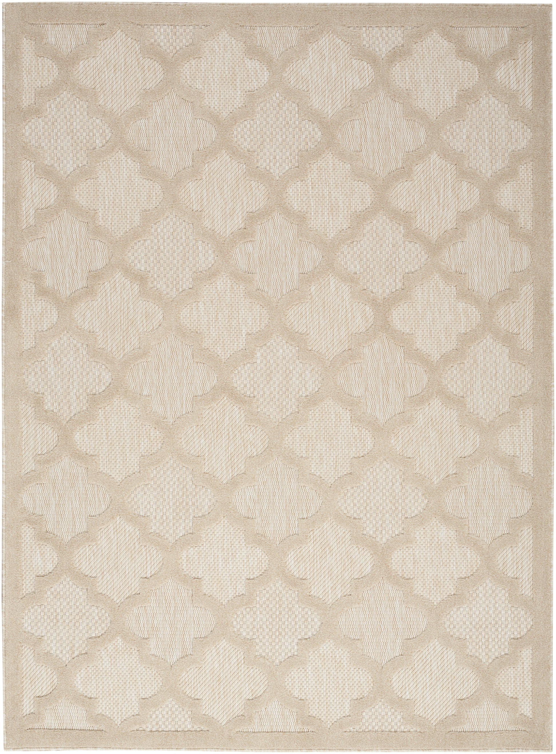 Beige woven area rug featuring a cream and tan quatrefoil lattice pattern.
