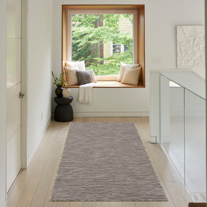 Soft gray woven runner rug with a subtle diamond pattern in a bright hallway by a window seat.