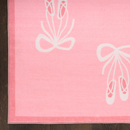 Soft pink fabric towel with white ballet slippers and bow motifs, pink border, decorative home accessory.