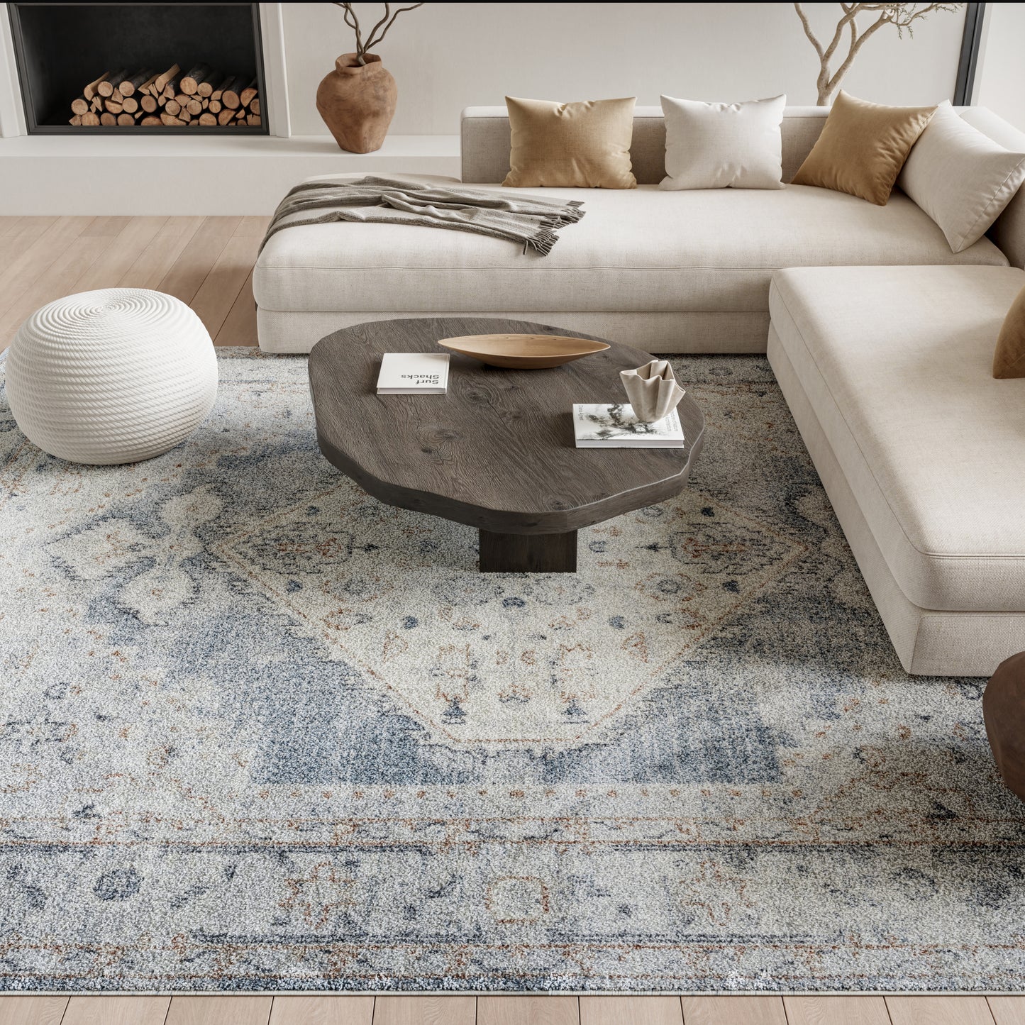 Beige rug with a blue-gray pattern, 8' x 10'.