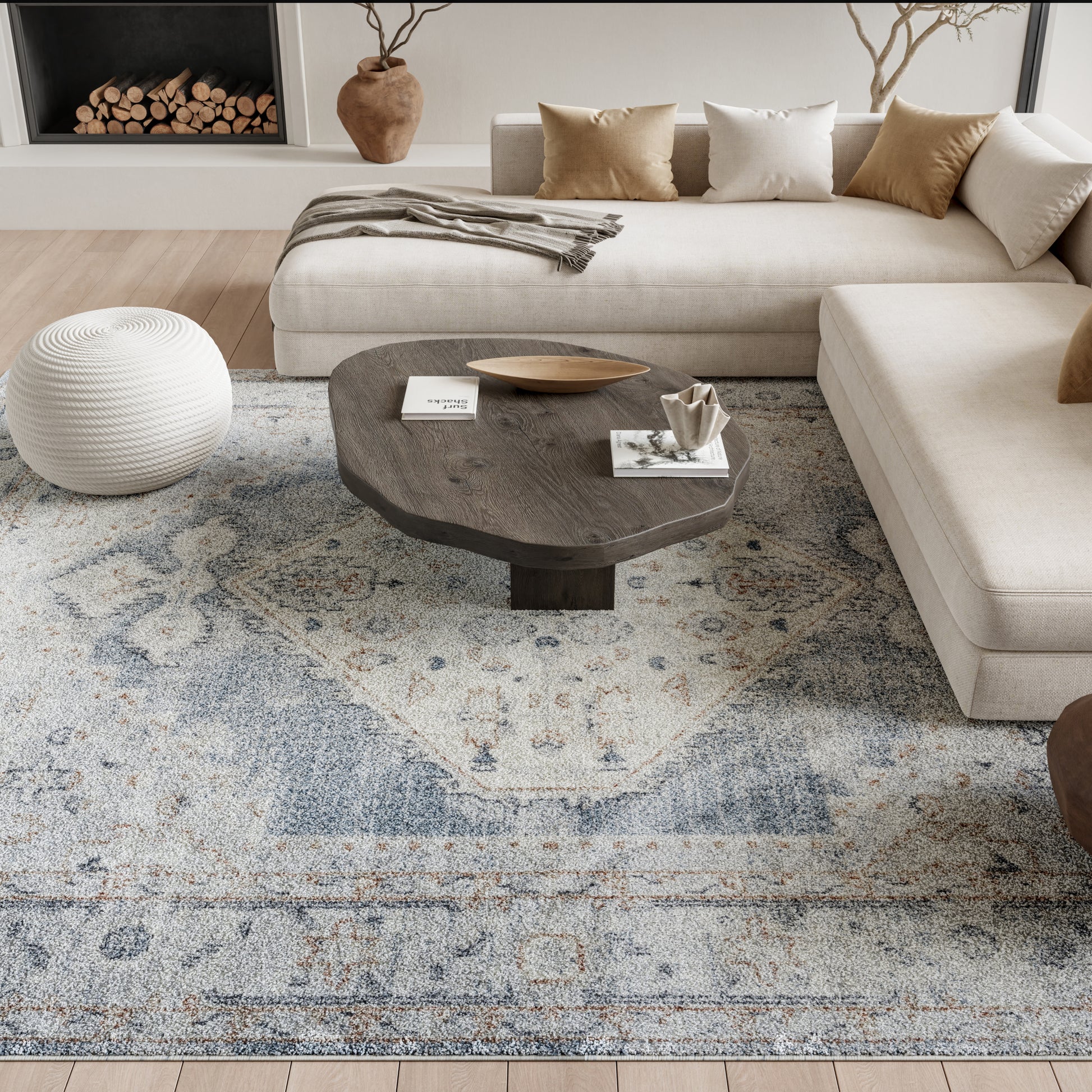 Beige rug with a blue-gray pattern, 8' x 10'.