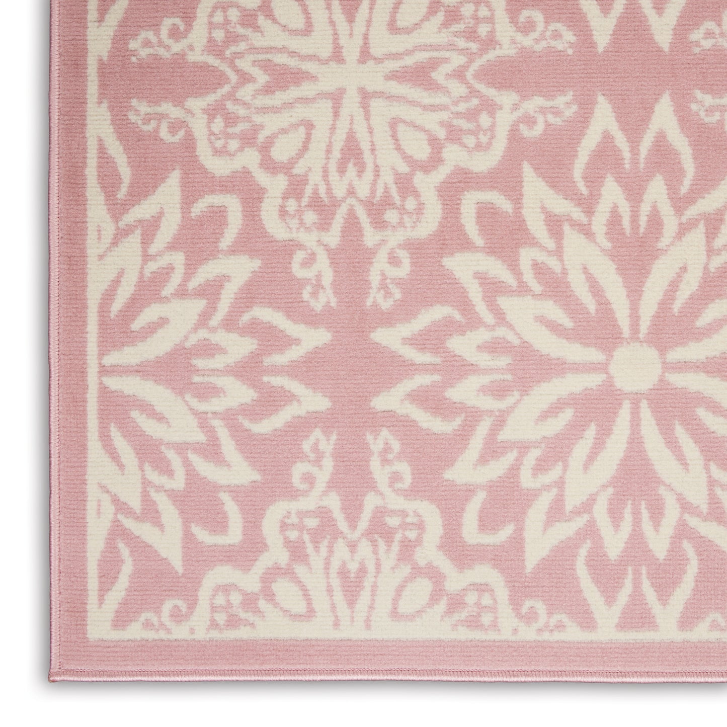 Pink woven rug with white mandala floral pattern and pale pink border, decorative home decor.