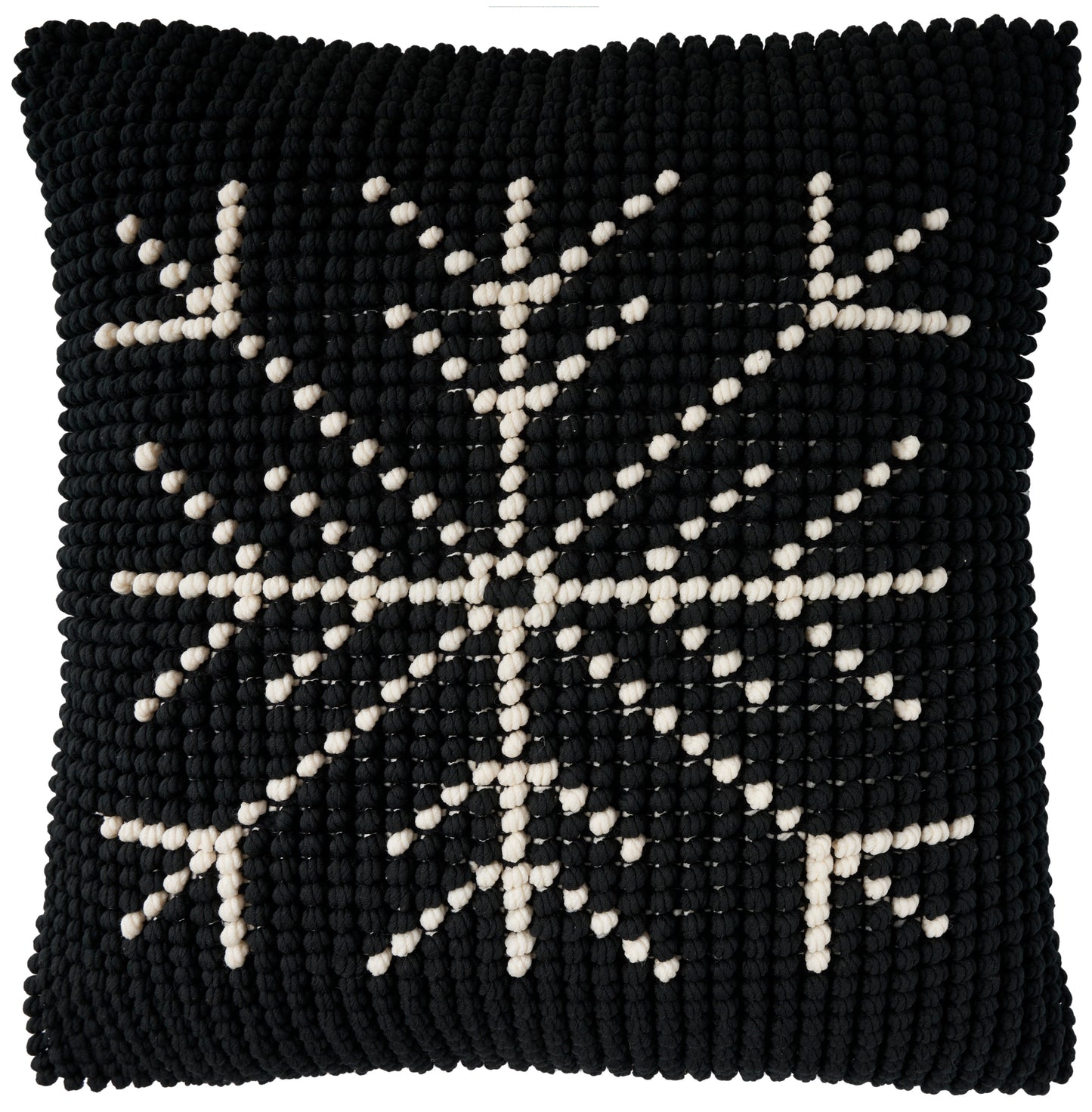 Black square knitted throw pillow with ivory snowflake motif and chunky textured surface, 20 x 20 inches.