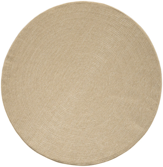 Round natural jute rug in beige with woven concentric rings; flat-weave, casual coastal style.