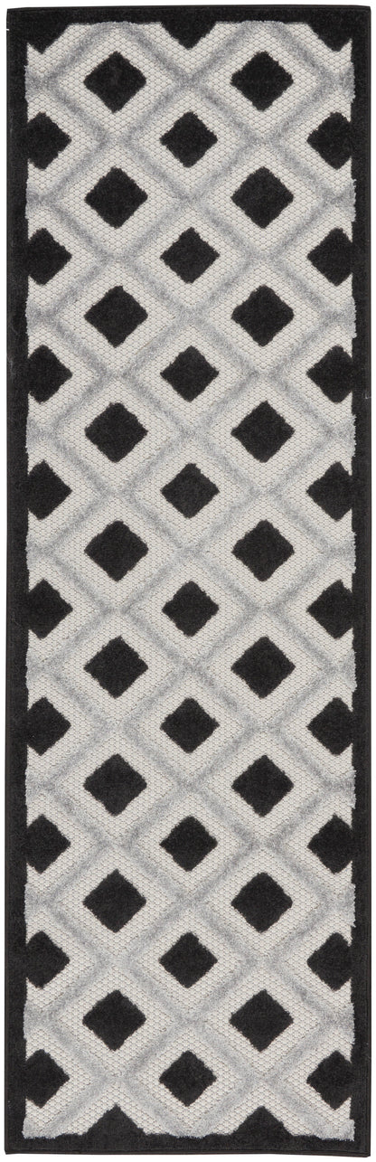 Rectangular rug with black border and gray diamond lattice pattern featuring black diamond shapes.