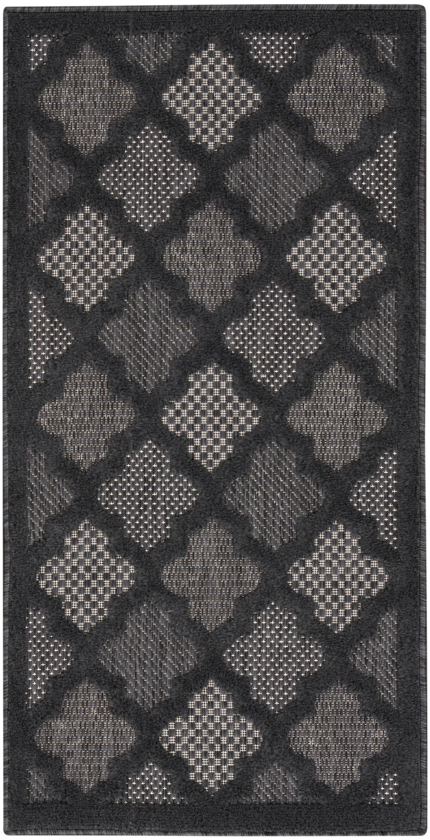 Charcoal rug with alternating light gray diamond shapes in a lattice pattern and textured inserts; dark border.
