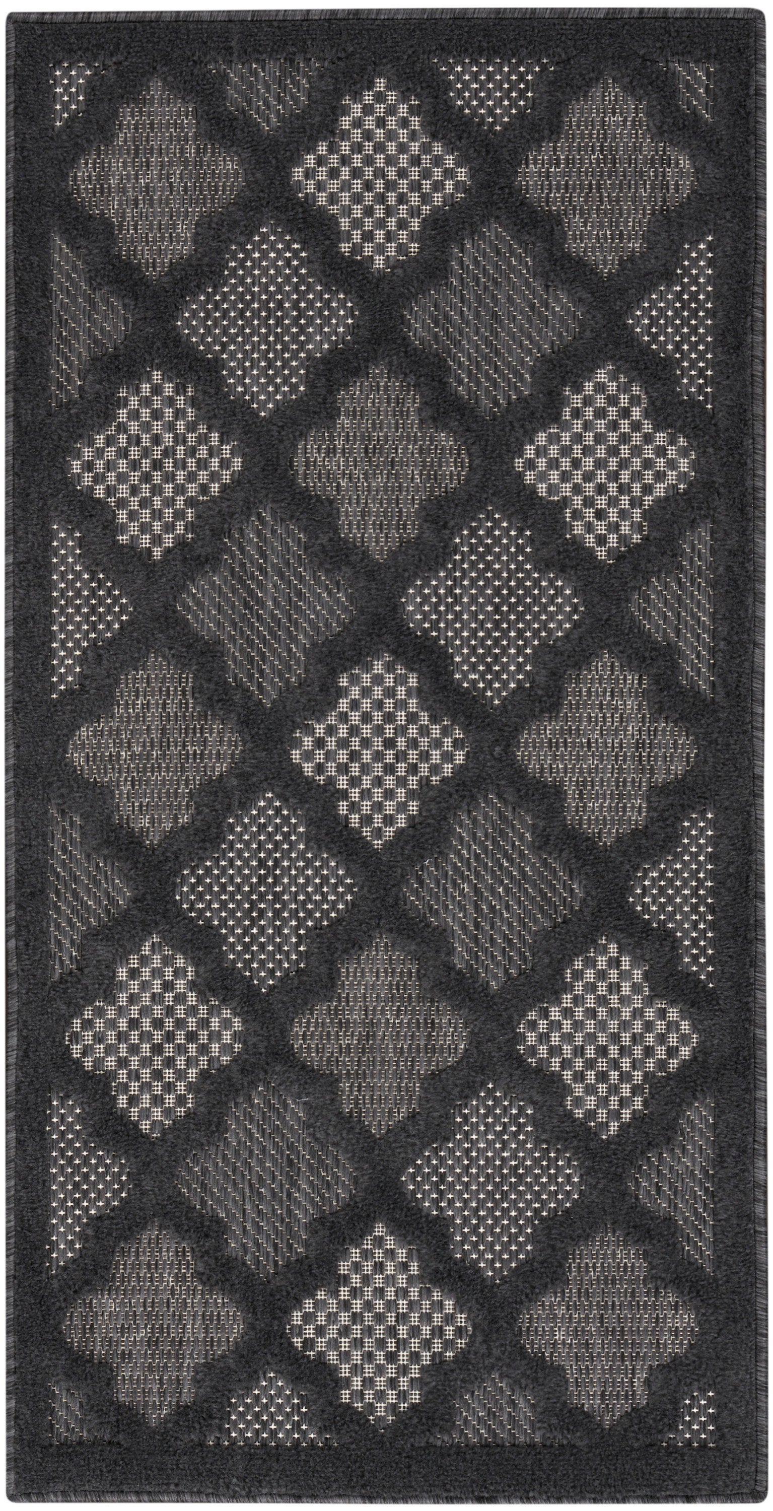 Charcoal rug with alternating light gray diamond shapes in a lattice pattern and textured inserts; dark border.