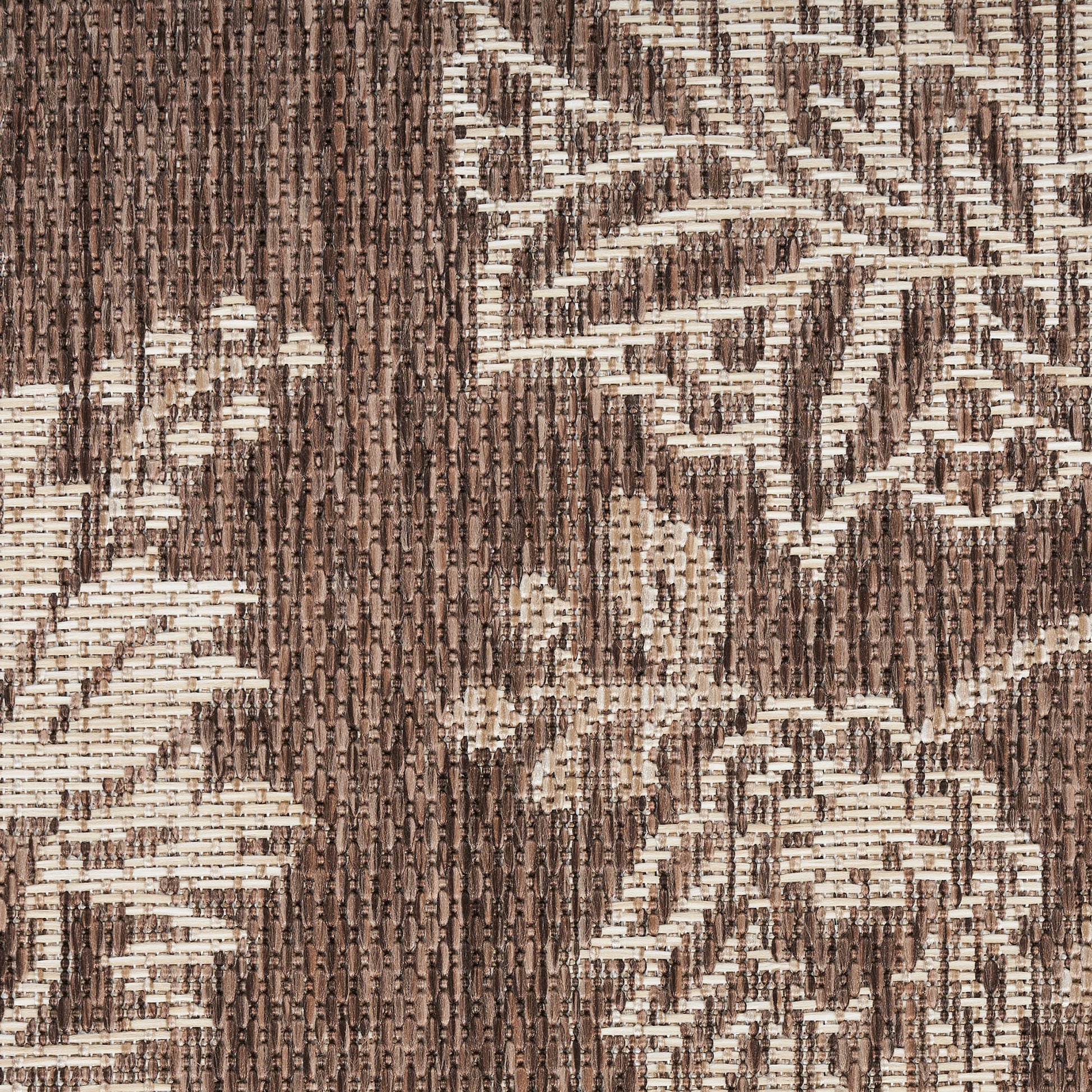 Brown and cream jacquard woven rug with floral vine motif; textured rug.