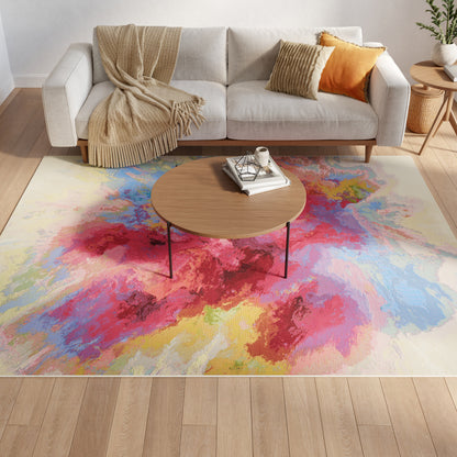 Cozy living room with a beige sofa, cream throw, orange pillows, and a wooden coffee table atop a vibrant abstract rug.