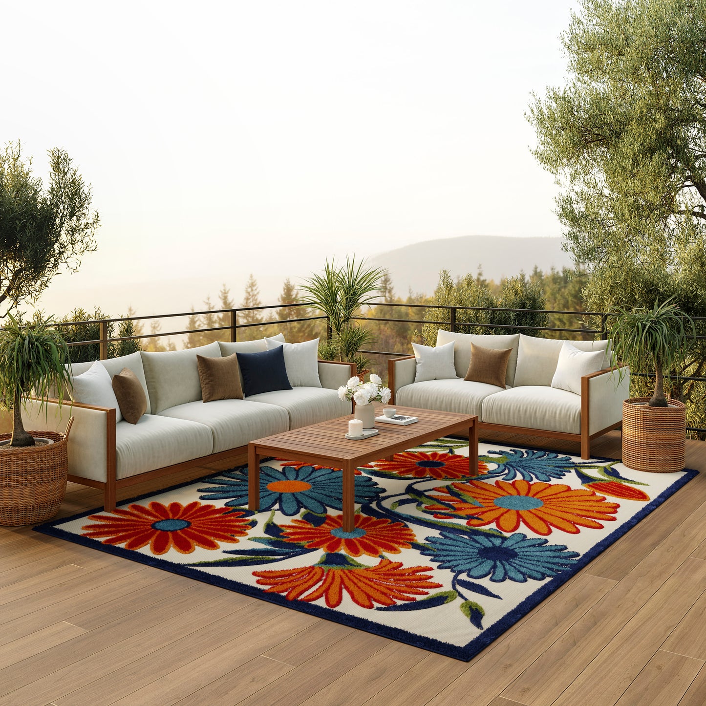 Outdoor modular sofa with cream cushions and brown pillows on a wooden deck, colorful floral rug, wooden coffee table.