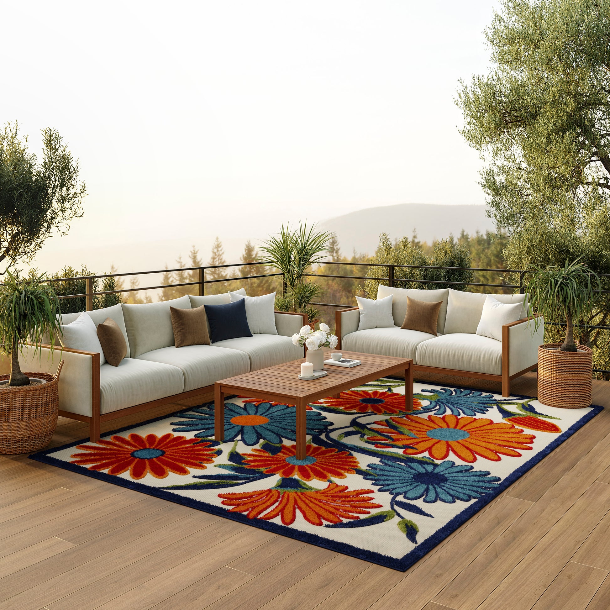Outdoor modular sofa with cream cushions and brown pillows on a wooden deck, colorful floral rug, wooden coffee table.