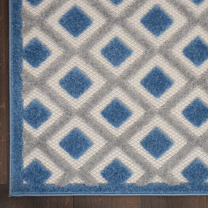 Blue-patterned modern 10 ft runner rug on a wooden floor