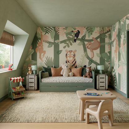 Green jungle-themed kids room with animal mural, green daybed, plush toys, nightstands, lamps, and a small table with chairs.