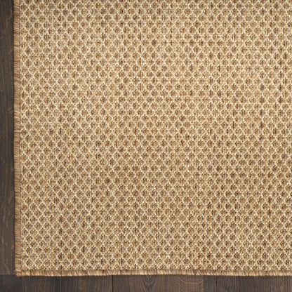 Beige natural-fiber rug with a tight lattice weave and a dark wood border along one edge; rectangular rustic rug.