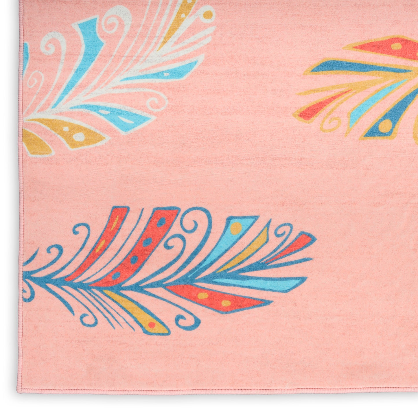 Soft pink towel with colorful feather-inspired motifs in blue, orange and yellow.