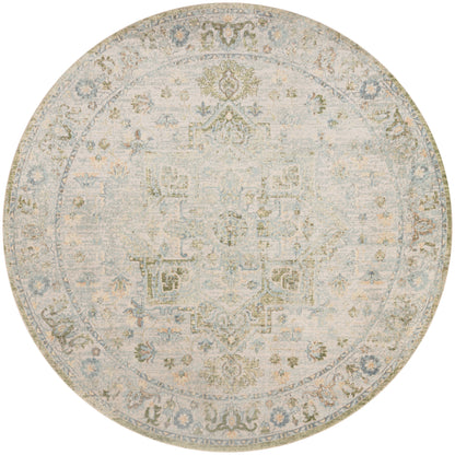 Round distressed area rug in muted beige, blue and gray with an antique floral medallion pattern; vintage, versatile decor.