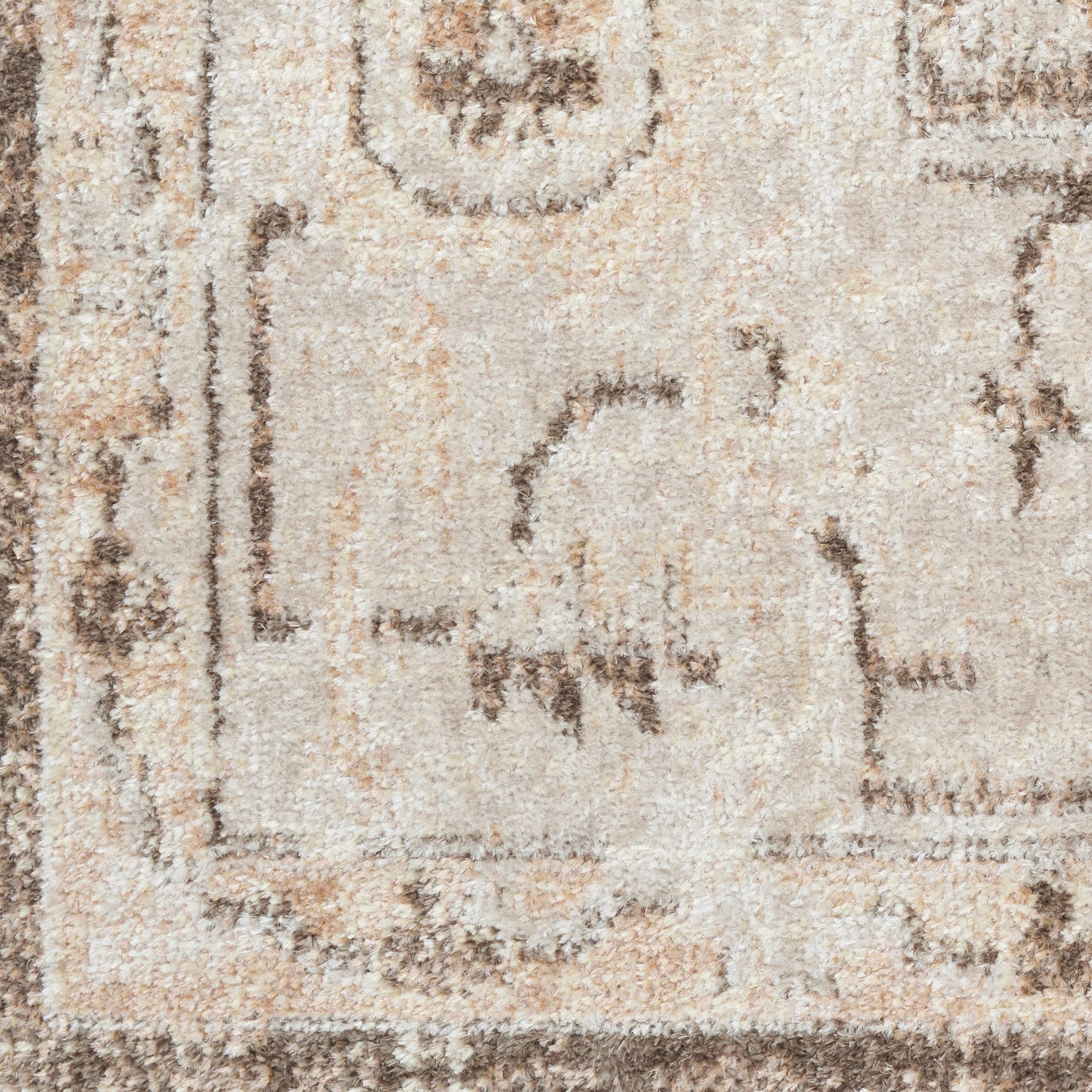 Beige oriental-inspired shag rug with brown border and subtle geometric motif; soft, plush pile.