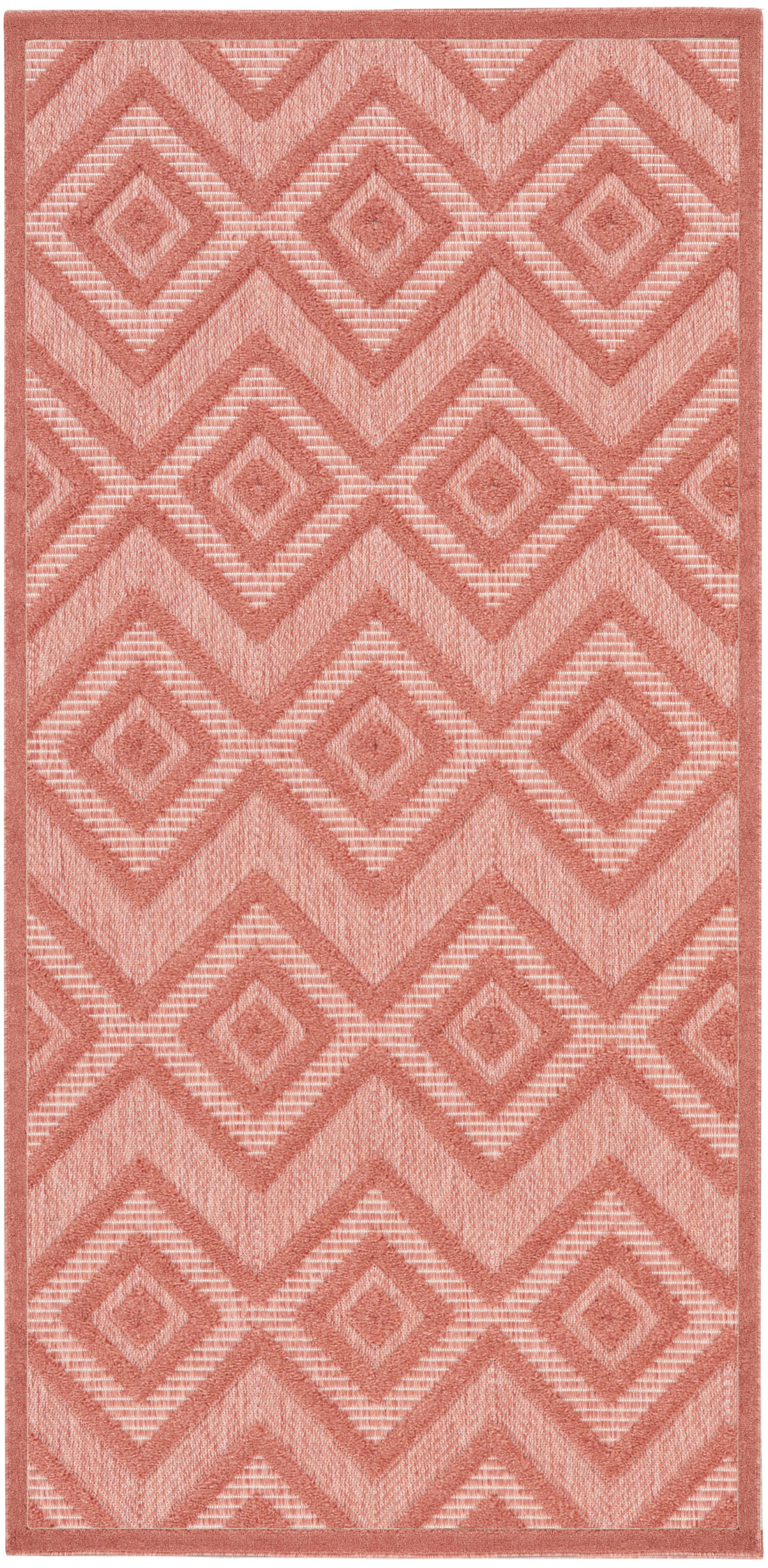 Peach geometric area rug with diamond motifs in layered chevrons; soft woven texture, rectangular shape, modern boho style.