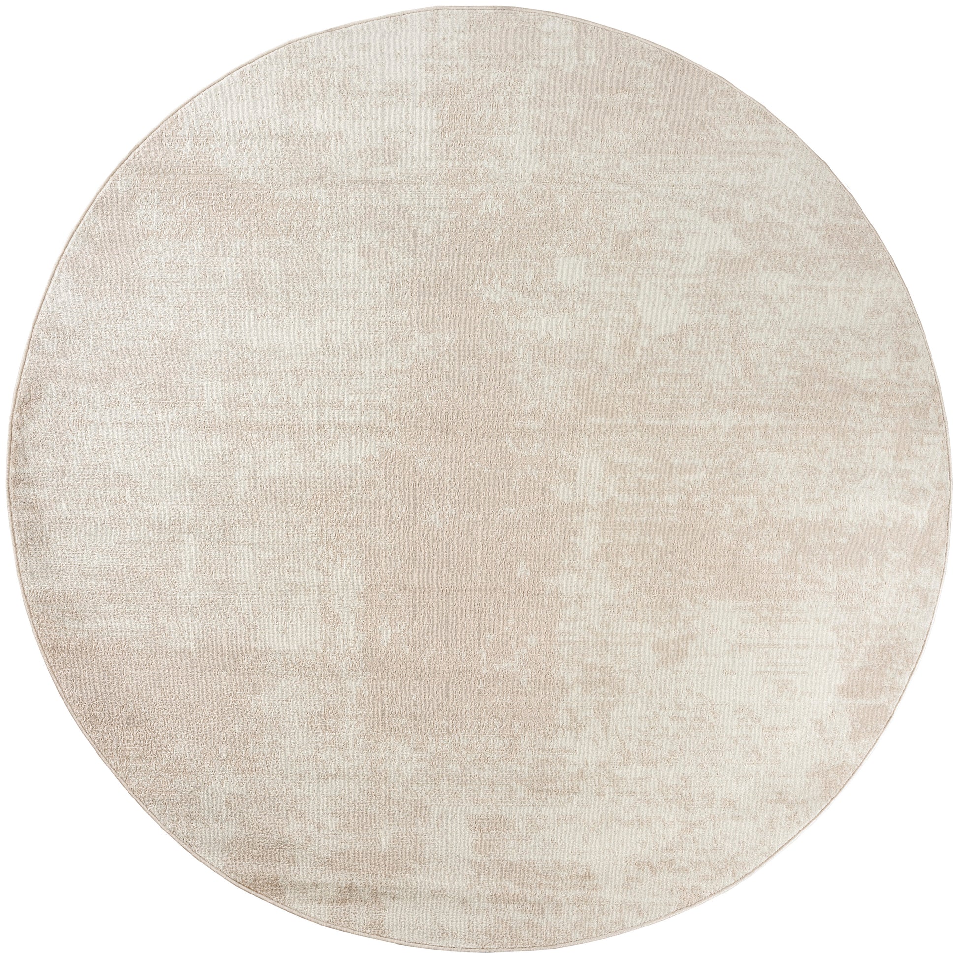 Round beige rug with a soft, mottled texture and subtle distressed pattern.
