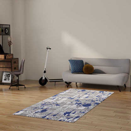 Modern living room with light gray fabric sofa, blue throw pillow, mustard round cushion, blue-gray rug, and a white scooter.