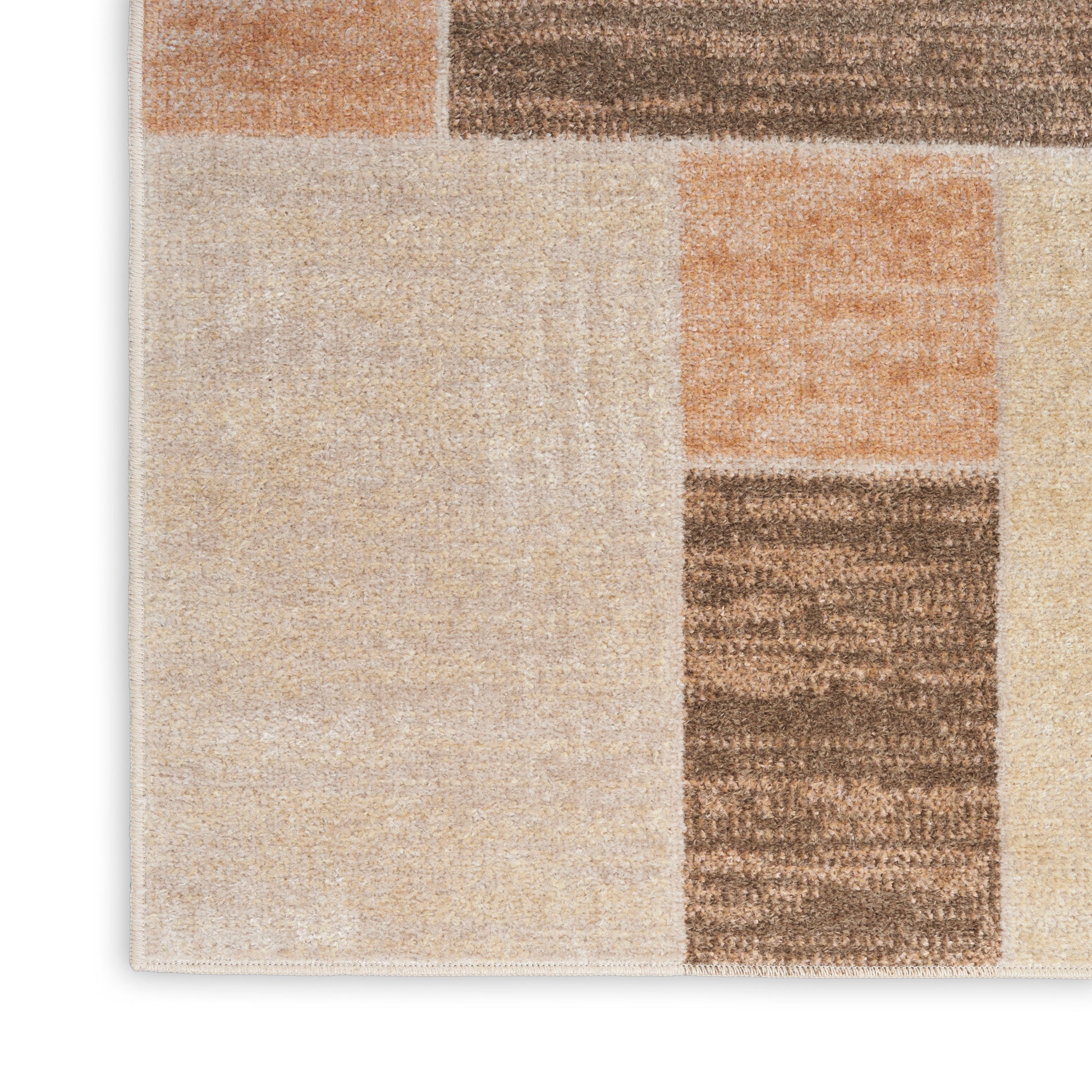 Beige, cream and brown patchwork area rug with geometric blocks and soft woven texture.