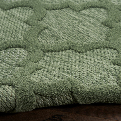 Olive green textured rug with a raised geometric lattice pattern and plush looped pile.