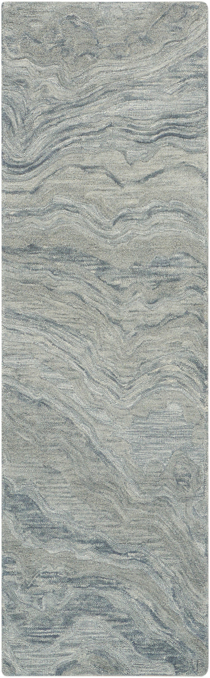 Soft gray-blue abstract-patterned rug runner with rounded corners and wavy textured loop pile.