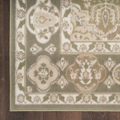 Traditional ornate area rug with beige, ivory, sage and taupe floral medallions and border on dark wood floor.