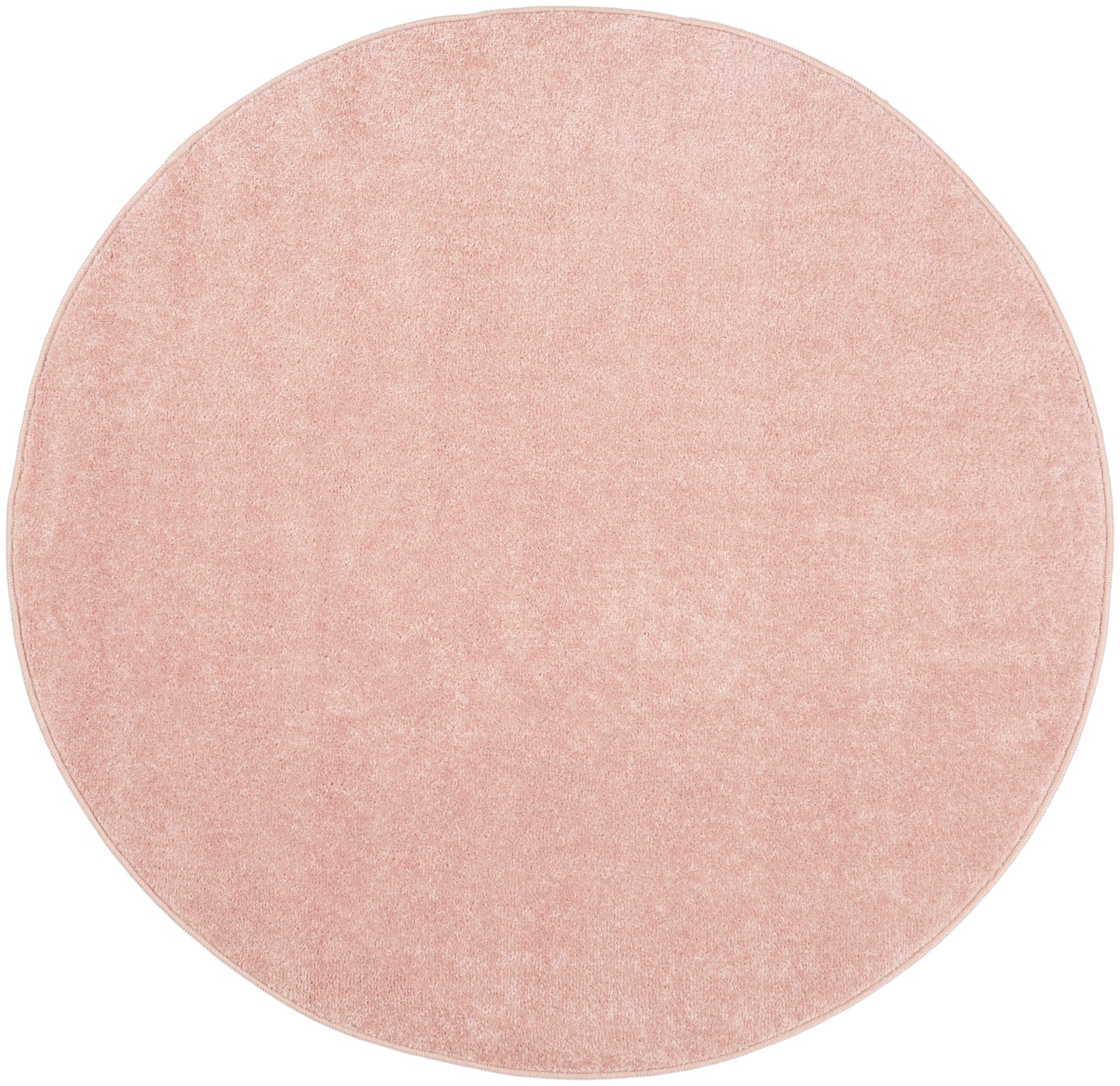 Round pink plush rug with soft pile; ideal for bedroom or living room.