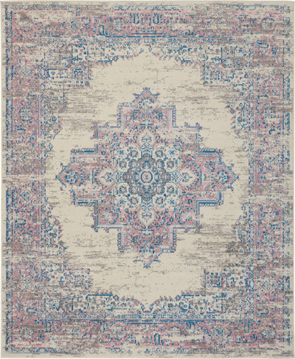 Distressed ivory oriental rug with soft blue and pink central medallion and ornate border; vintage-inspired rectangle.