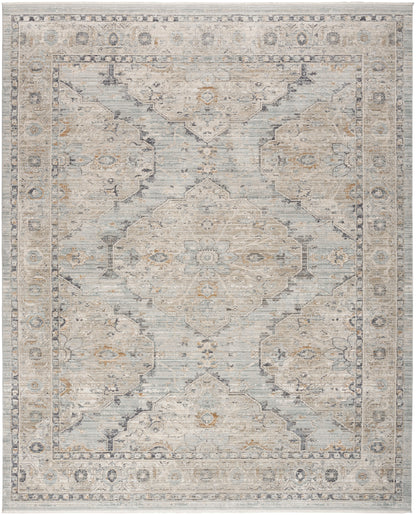 Rectangular area rug in muted blue-gray, ivory and beige with a central medallion and floral border in antique style.
