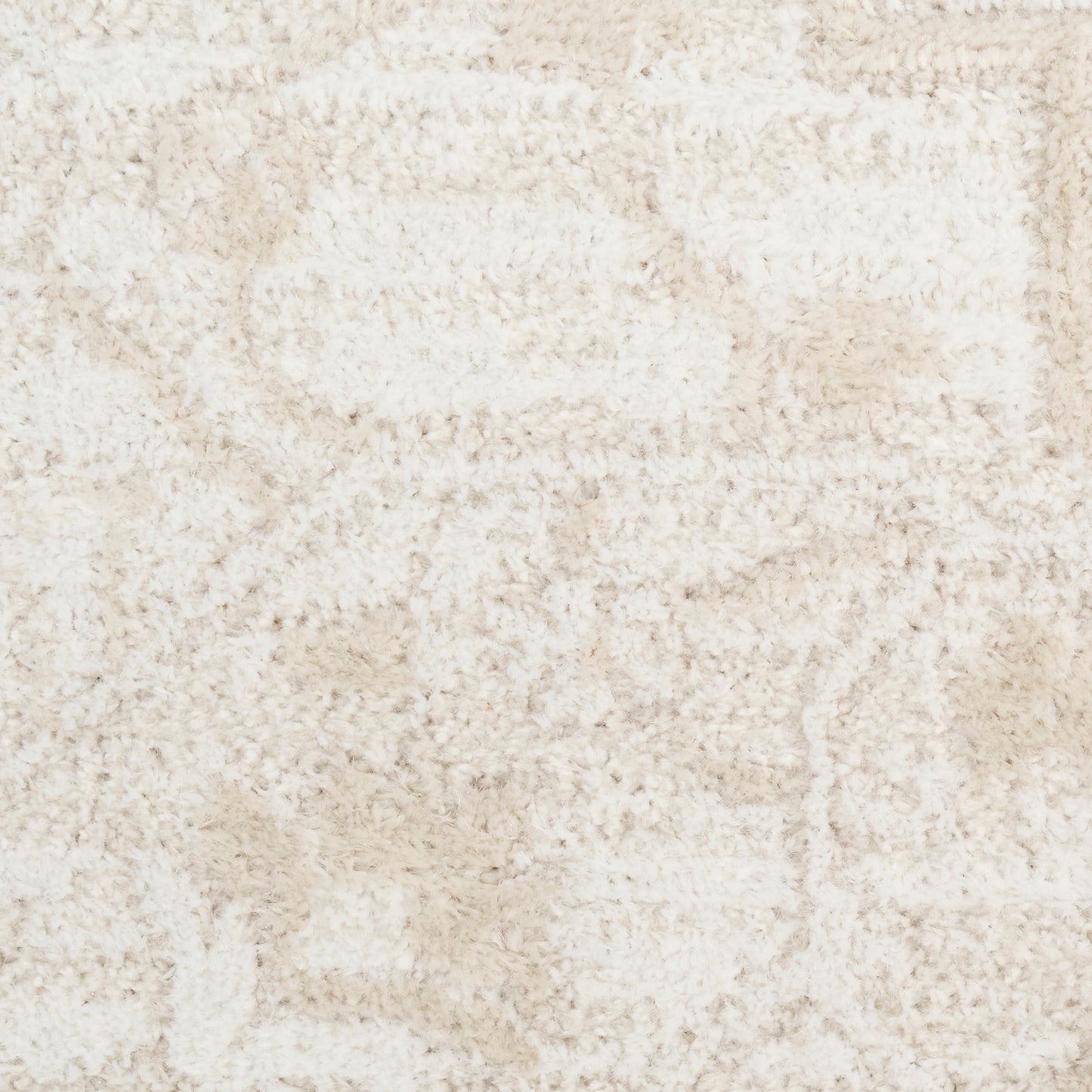 Cream beige shag rug with plush pile and subtle abstract geometric pattern; ideal for living room.