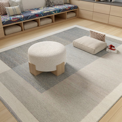 Cream geometric-pattern rug in beige and gray tones.