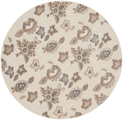 Round beige area rug with brown and taupe floral pattern, subtle textured background, vintage-inspired decor.