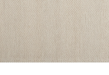 Beige woven fabric with tiny raised dot pattern, upholstery texture.