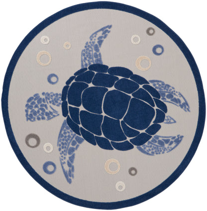 Round rug featuring a navy blue sea turtle mosaic on light grey with a dark blue border and bubbles.
