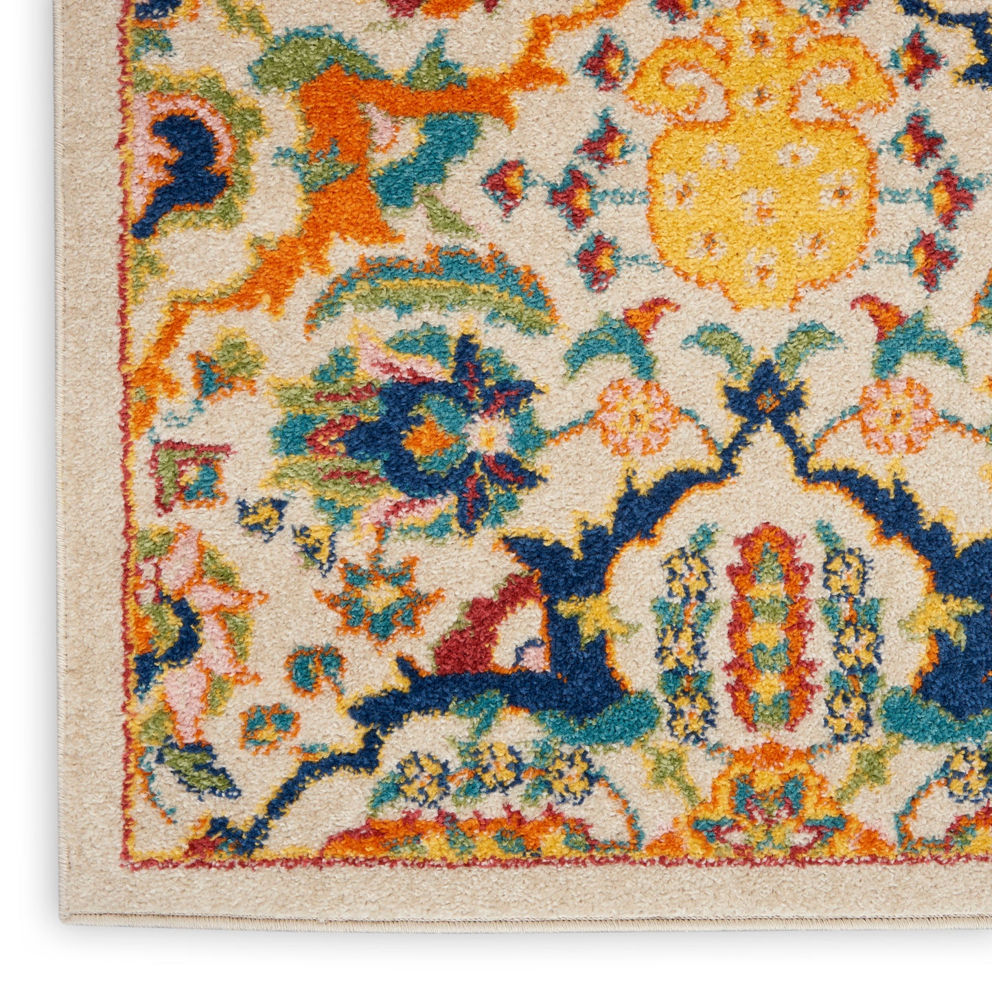 Colorful Bohemian runner rug with cream base and ornate floral border in blue, orange, yellow, teal.