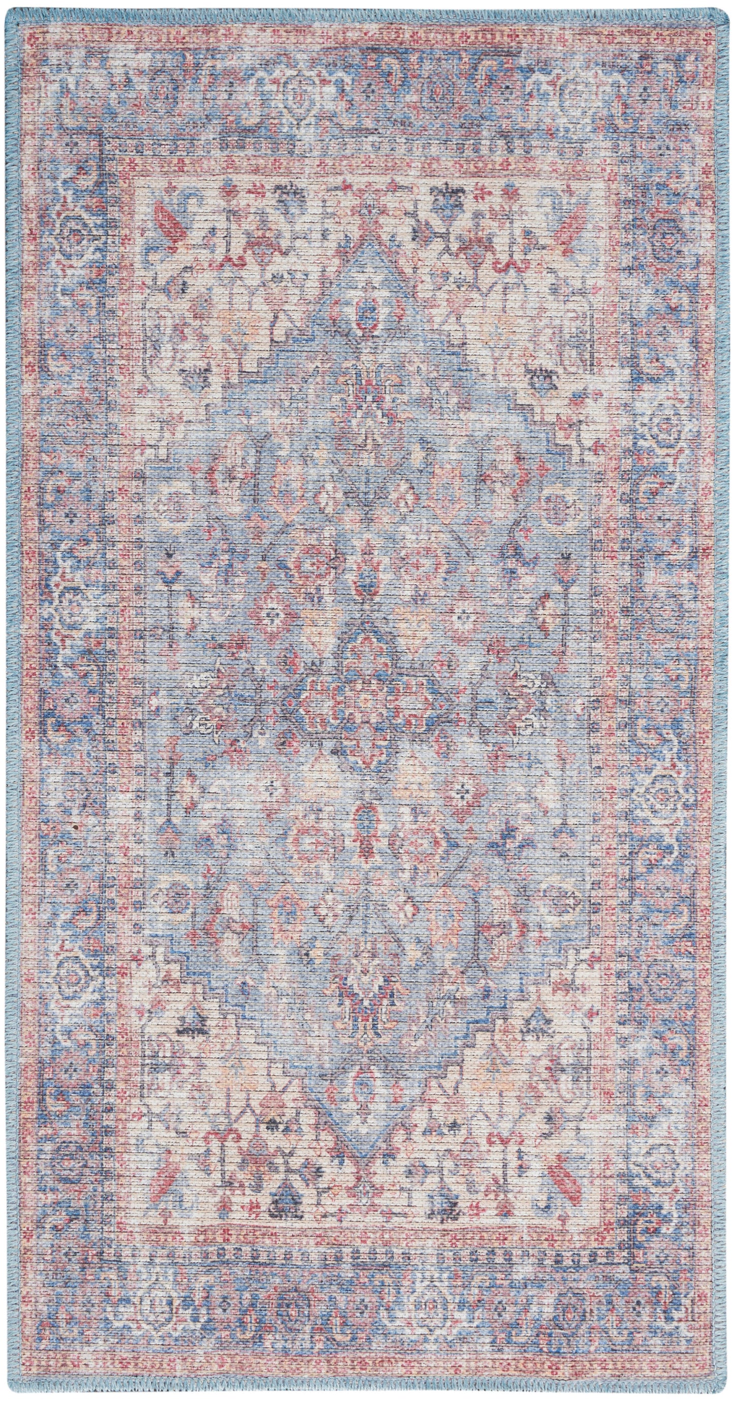Distressed blue-and-cream oriental rug with pink accents, featuring a central medallion and ornate border patterns.