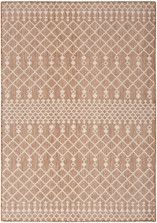 Rectangular beige woven rug with white lattice diamond pattern and dotted borders, cozy living room decor.