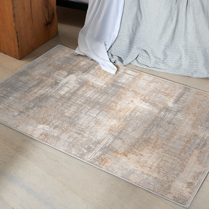 Abstract beige, tan and ivory low-pile area rug; rectangular, soft texture for bedroom decor.
