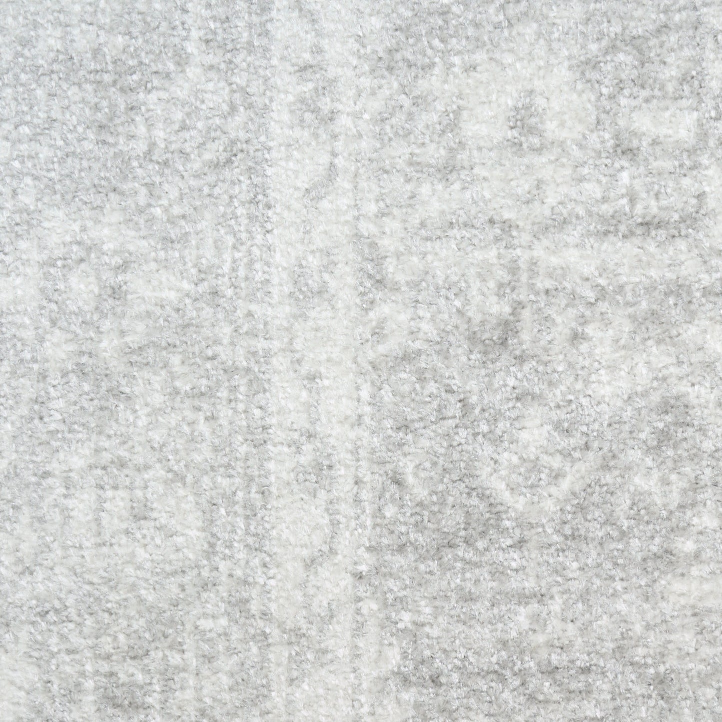 Light gray plush rug with soft, dense pile and subtle marbled texture, ideal as an area rug