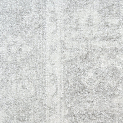 Light gray plush rug with soft, dense pile and subtle marbled texture, ideal as an area rug