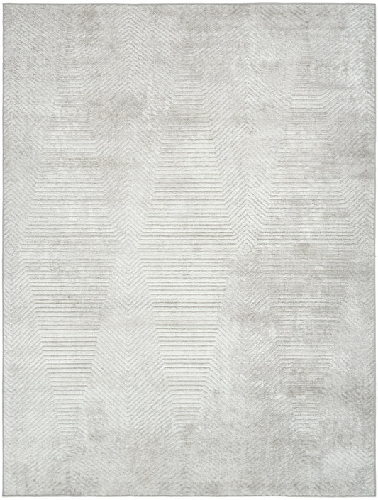 Light gray area rug with a subtle geometric chevron pattern and distressed, vintage-inspired texture, 4' x 6'.