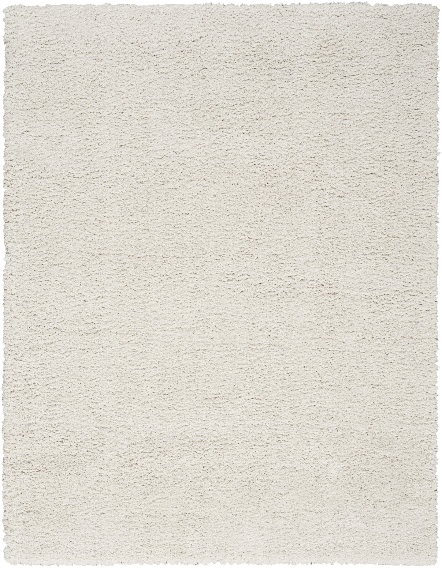 Cream-colored plush shag rug with a soft, high-pile texture; rectangular floor rug for living spaces.